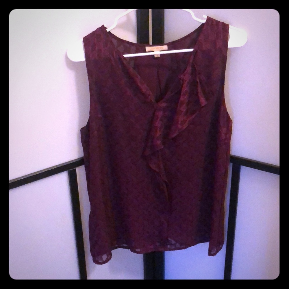 Skies and Blue- burgundy sleeveless shirt.